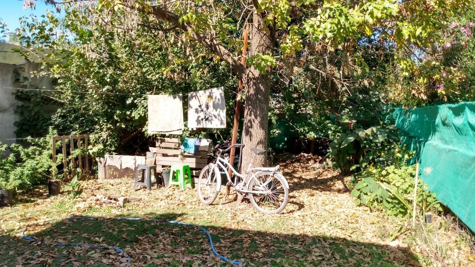 TERRENO URBANO CON CASA A TERMINAR